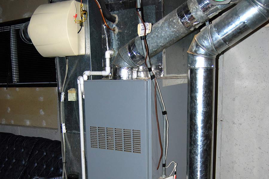 Basement furnace unit with ductwork and humidifier system